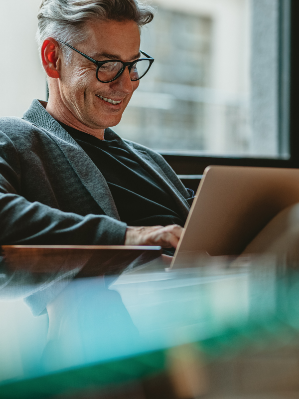 person sat with laptop